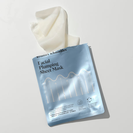 Woman using Facial Plumping Sheet Mask - 5 Pack as part of her skincare routine